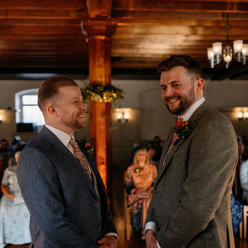 grooms-laughing-in-tweed-suits-for-ceremony