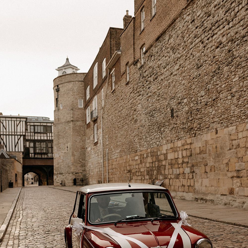 red-and-white-mini-wedding-car-with-white-ribbon