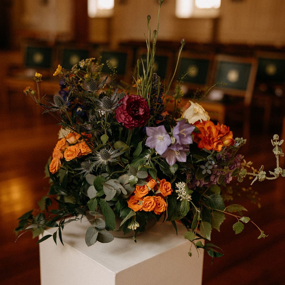 red-orange-lilac-wedding-flowers-for-ceremony
