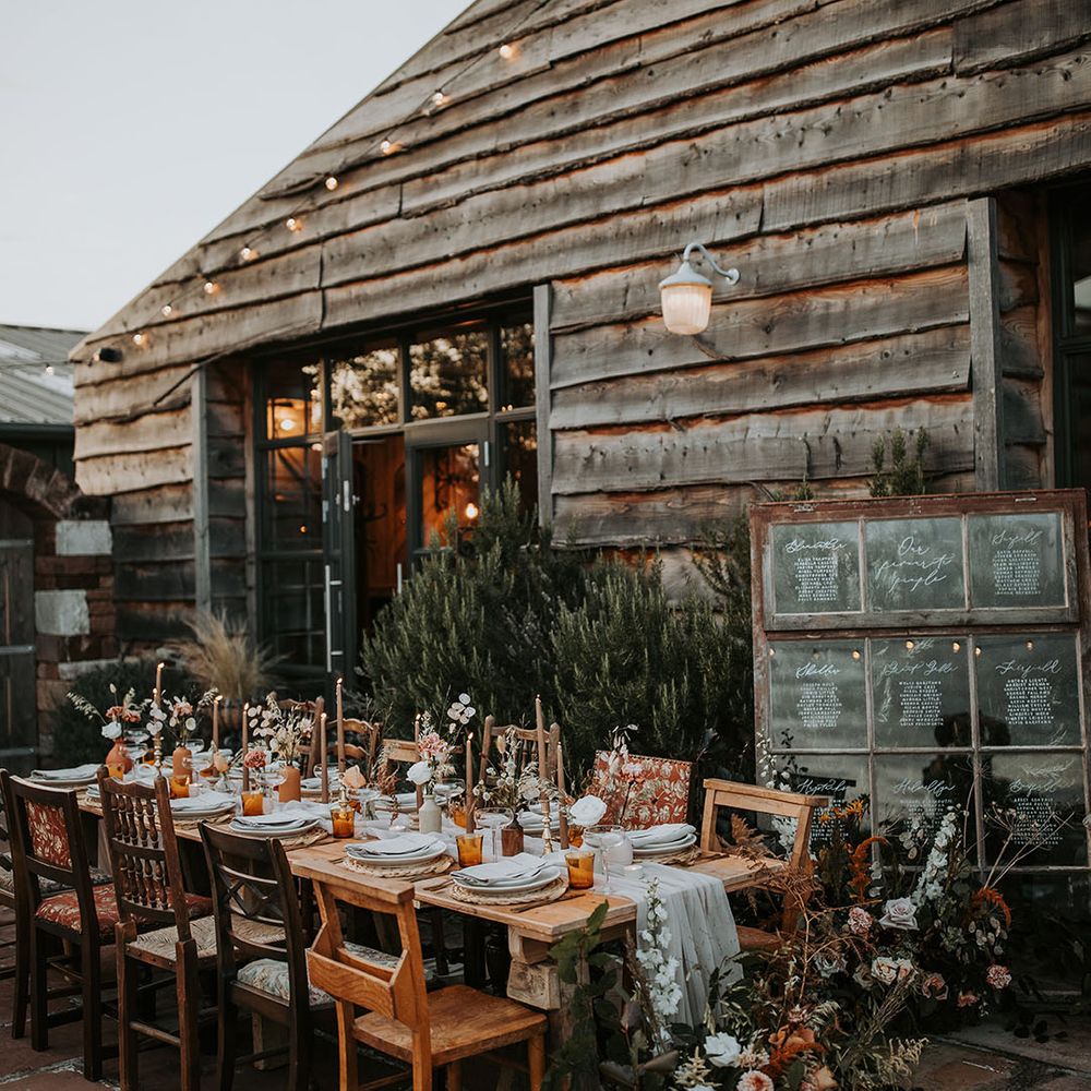 Outdoor wedding breakfast at rustic barn venue