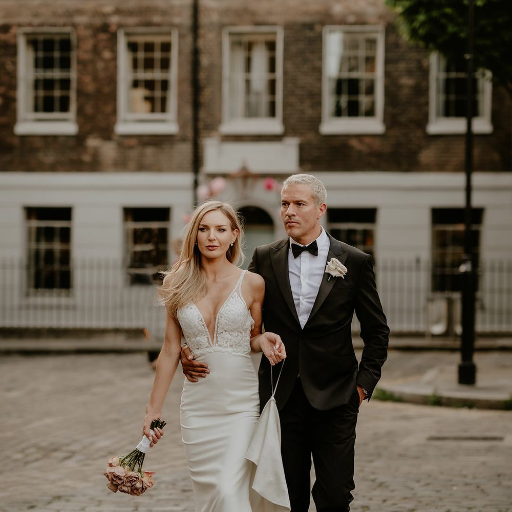Bride and groom walking in front of The Zetter