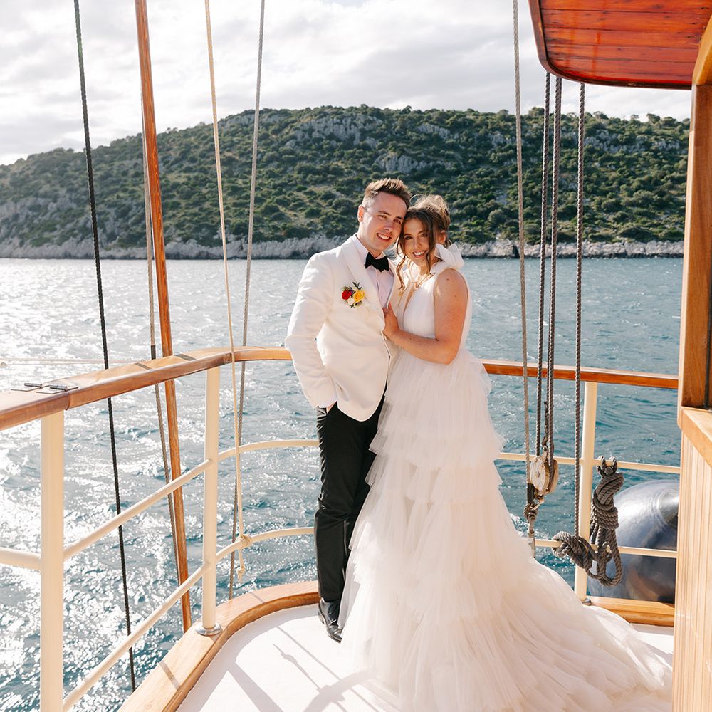 boat-wedding-in-croatia-with-groom-in-white-tuxedo