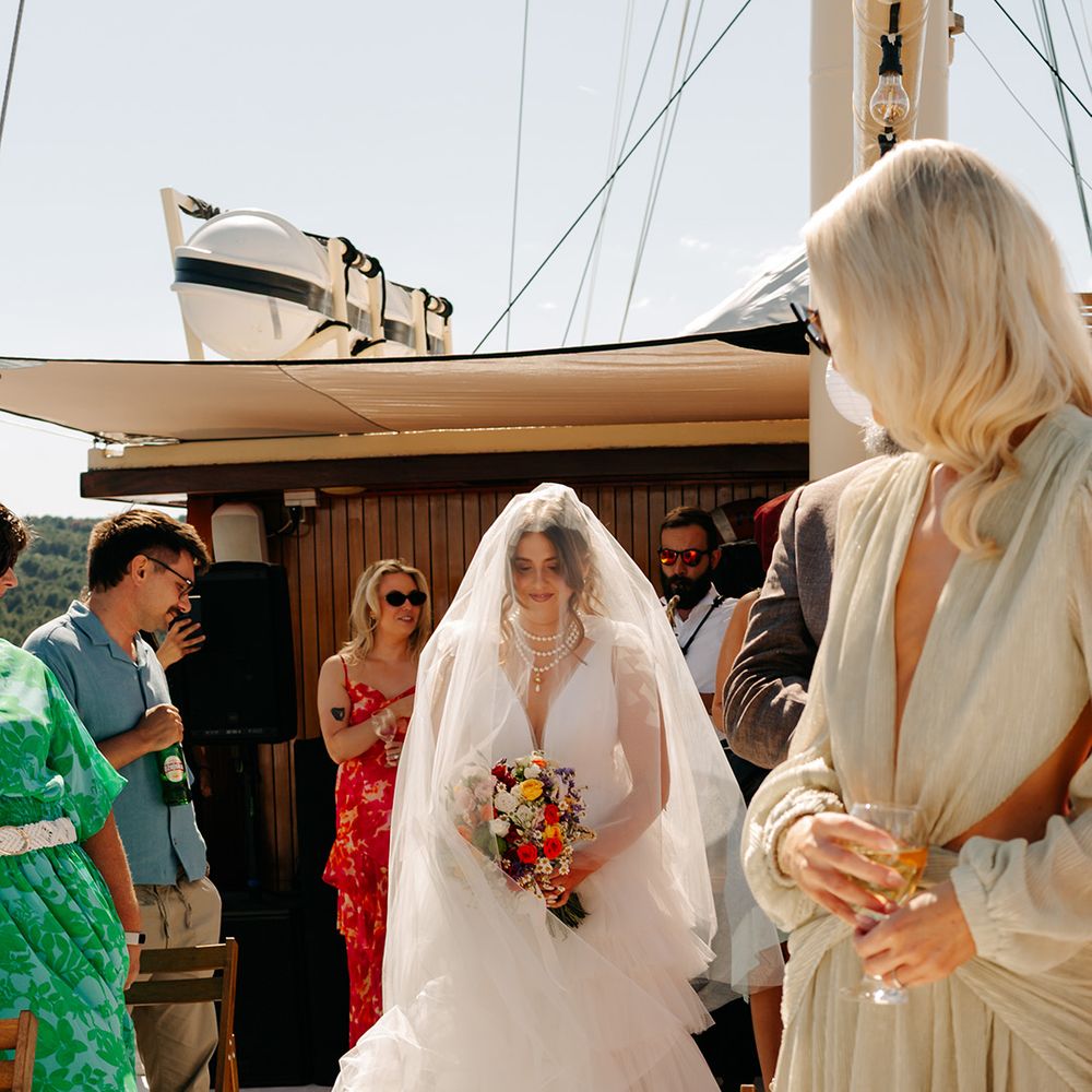 bride-walks-down-the-aisle-at-boat-wedding