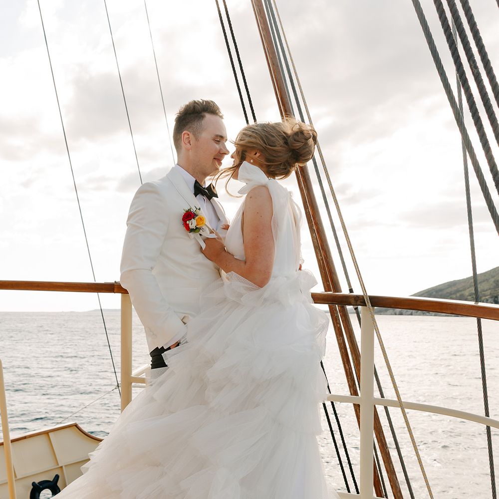 Croatia wedding with bride in ruffle wedding dress and groom in white tux