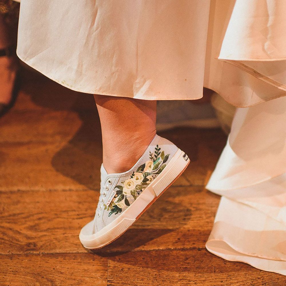 Blue trainers handpainted with flowers for bride
