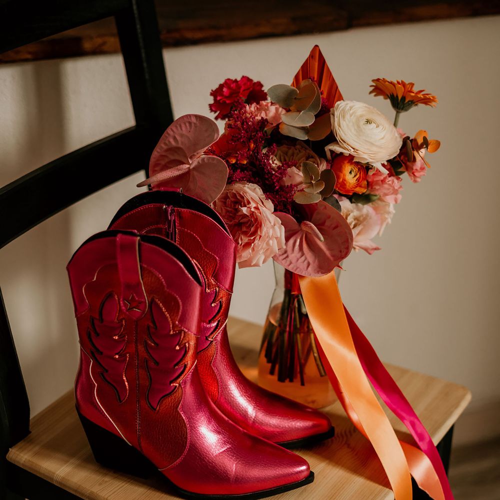 Pink metallic cowboy boots for the bride