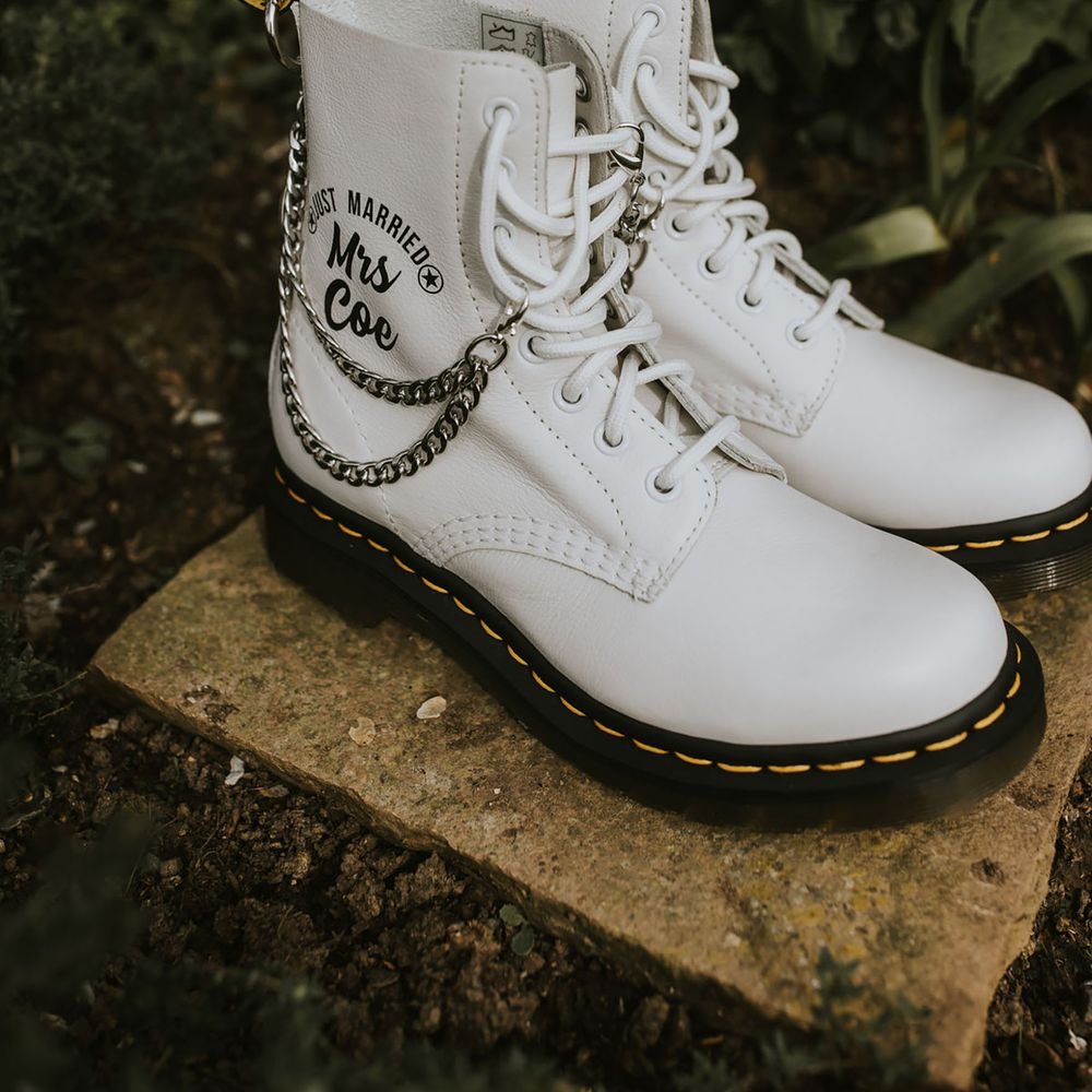White Doc Marten shoes personalised with chain and the bride's name