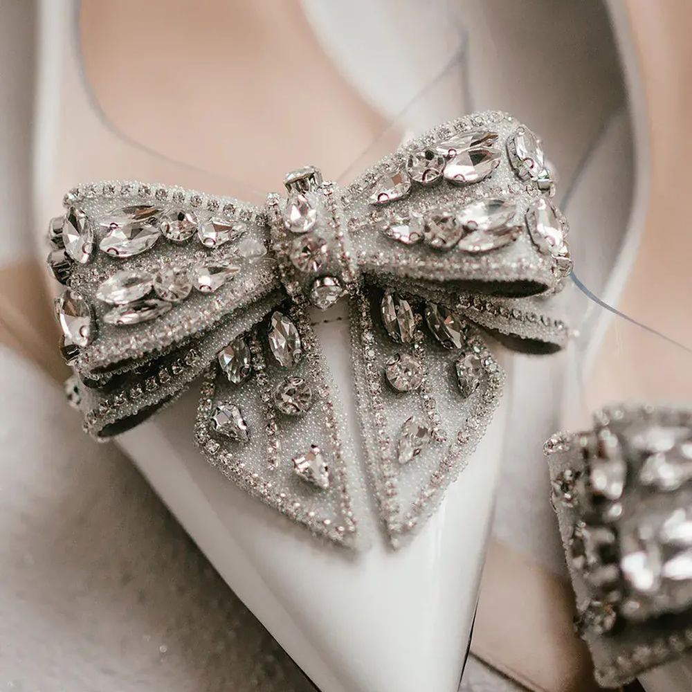 White pointed heel bridal shoes with sparkly embellished bow