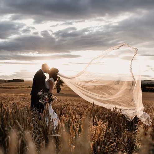 Stunning Portrait Of Scottish Wedding Couple With Veil In Wind