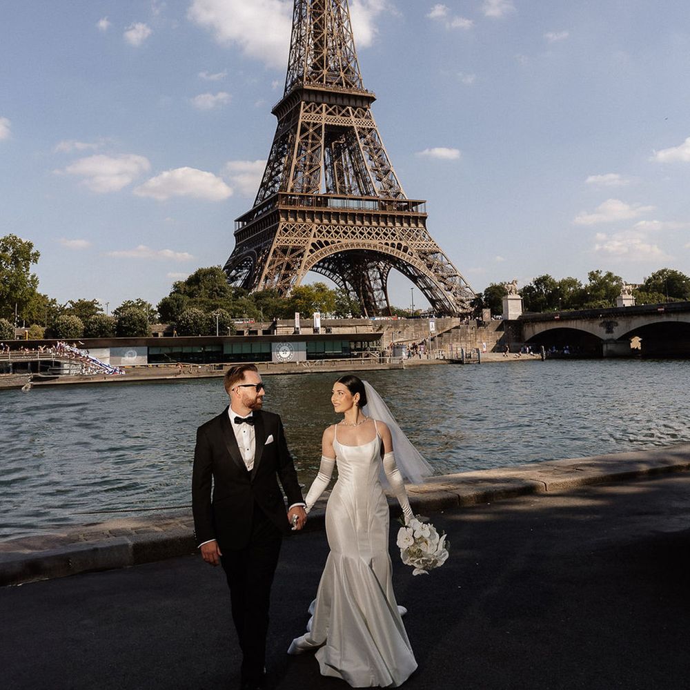 bride-and-groom-walking-in-front-of-eiffel-tower