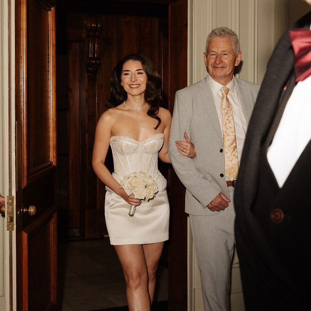 father-of-the-bride-in-grey-suit-walks-bride-into-registry-ceremony