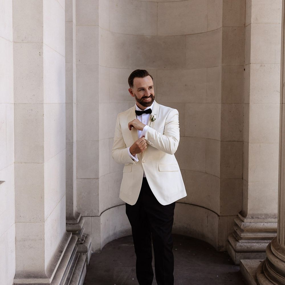 groom-in-white-tuxedo-at-chelsea-town-hall-wedding