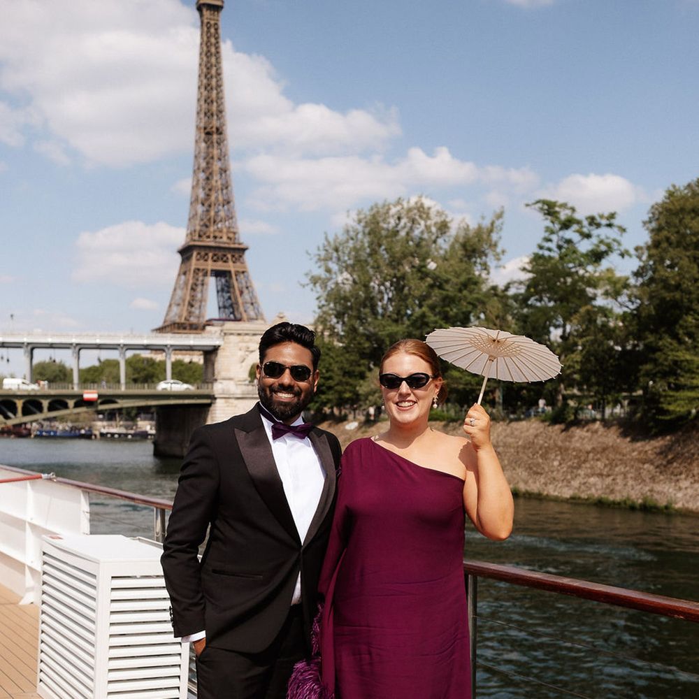 wedding-guest-in-burgundy-plum-dress-with-mini-umbrella