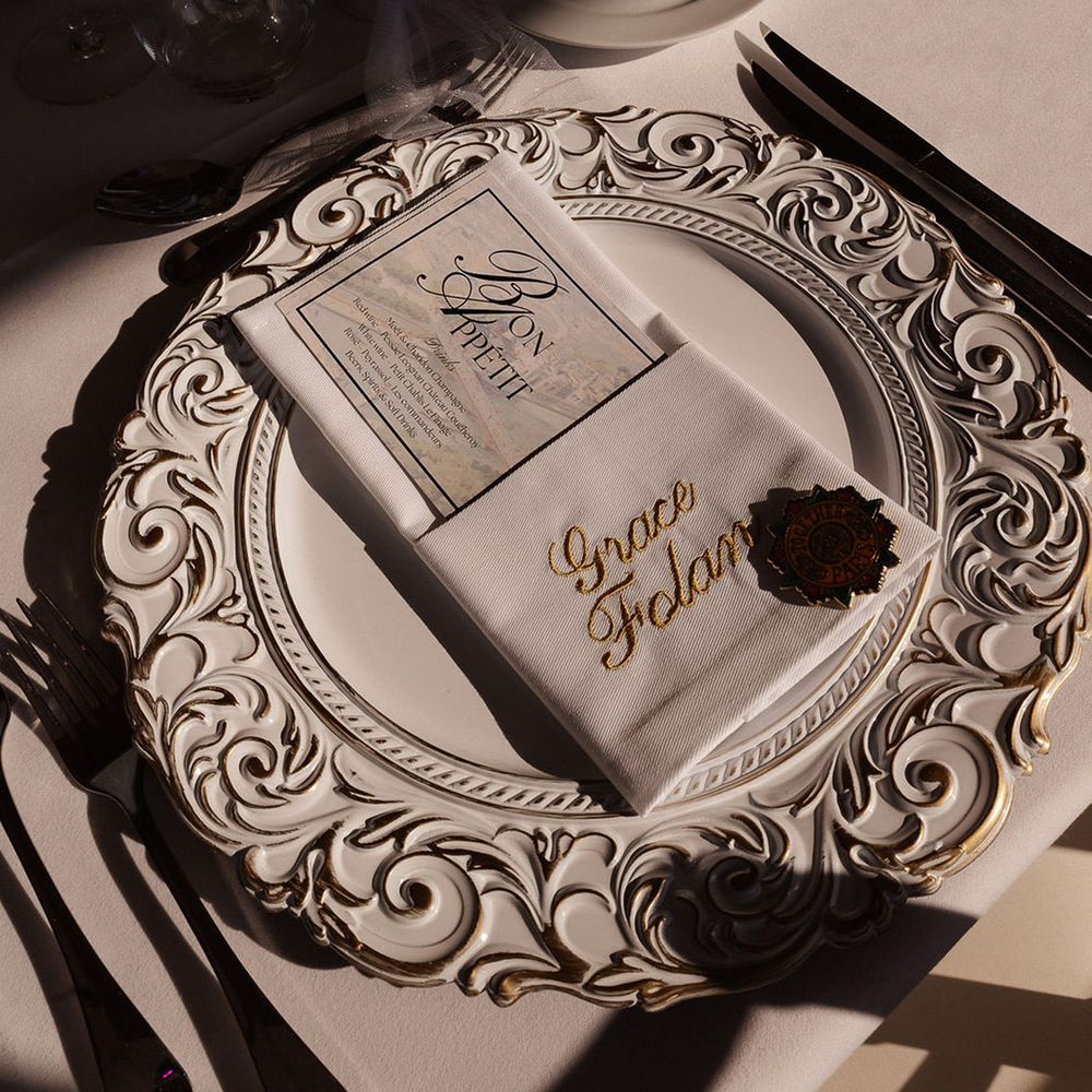 white-wedding-place-setting-with-intricate-patterned-charger-plate
