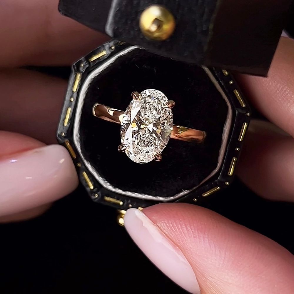 chunky-gold-band-oval-solitaire-diamond-ring