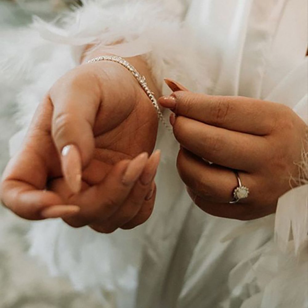 Bride with simple vintage inspired engagement ring