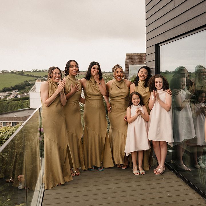 Bridal party first look at the bride in her wedding dress