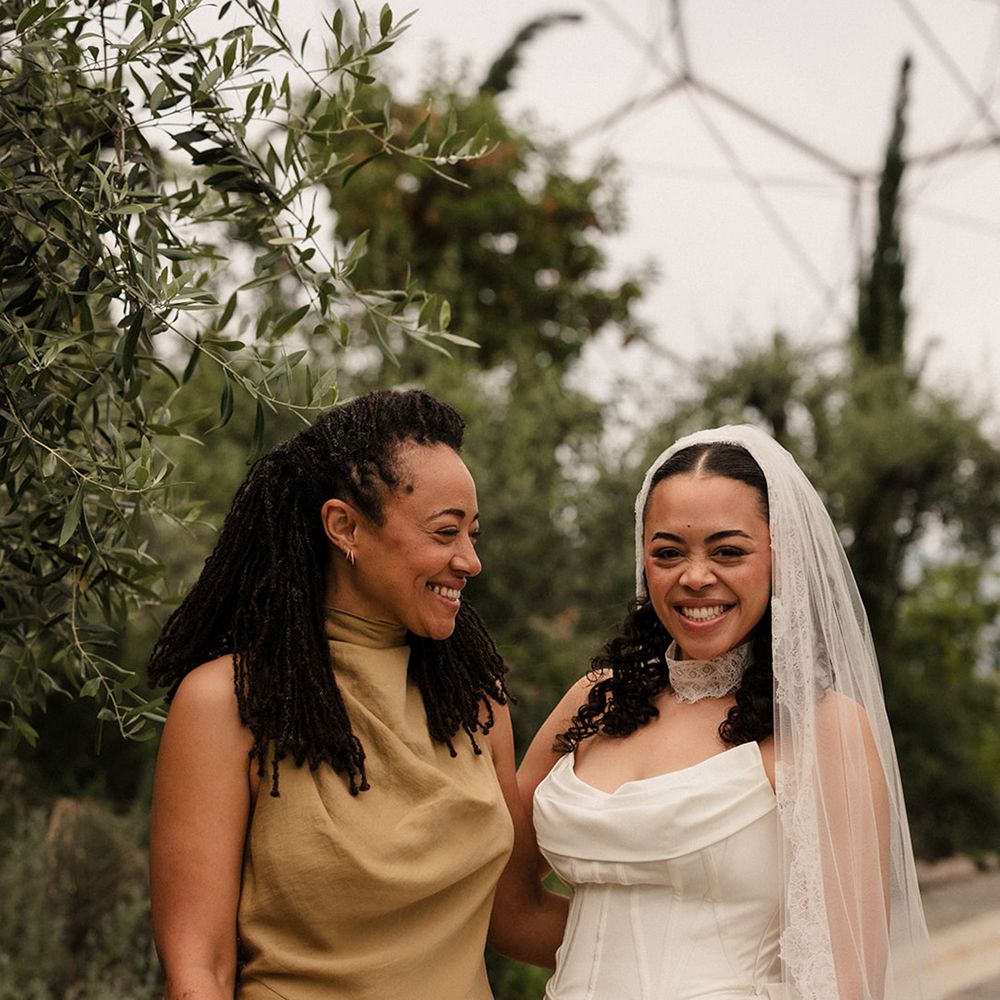 bridesmaid-in-olive-dress-with-bride-in-corset-dress