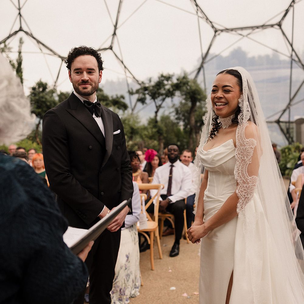 couple-laughs-during-wedding-ceremony-with-black-tie-dress-code