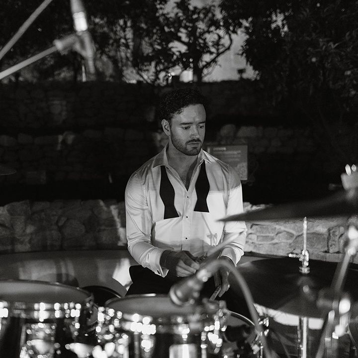 groom-plays-drums-with-wedding-band