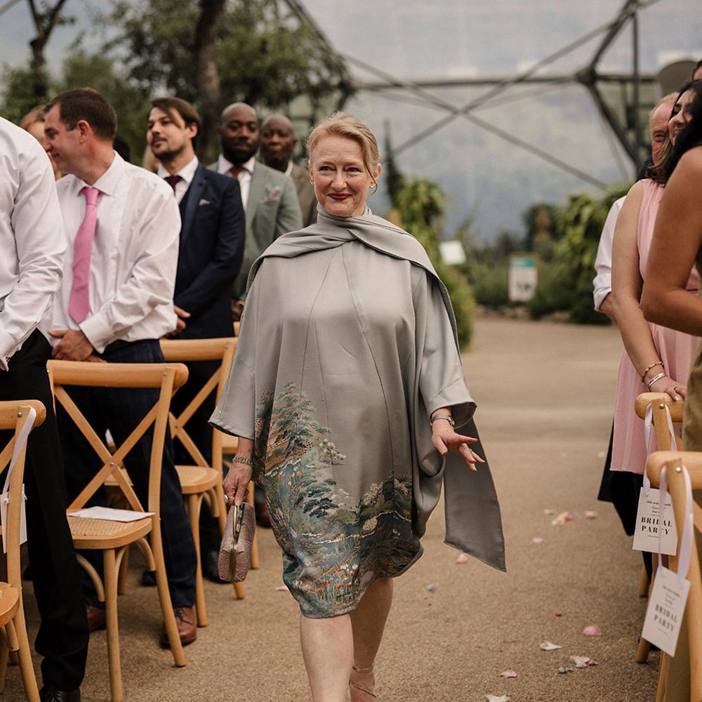 Mother of the bride in grey cape dress 