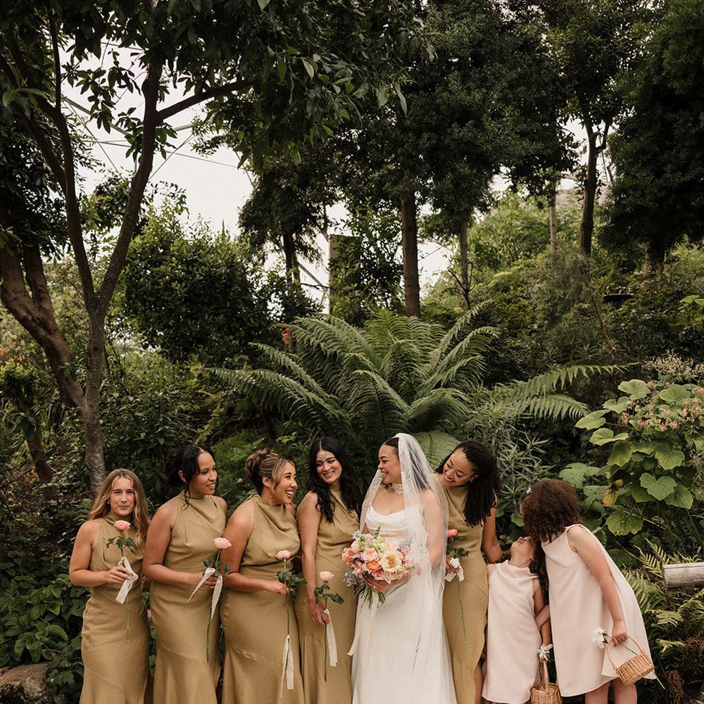 olive-green-bridesmaid-dresses-with-bride-in-modern-wedding-dress-and-pink-flower-girls