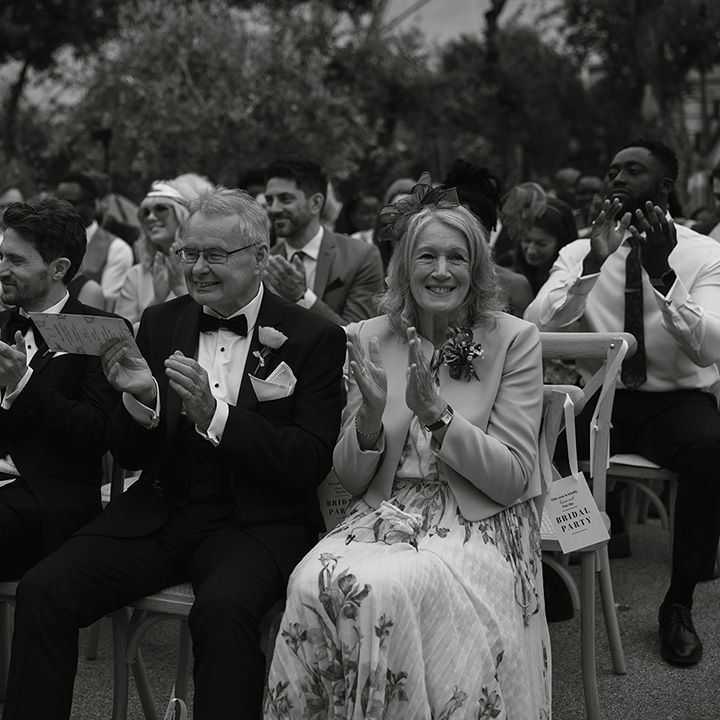 wedding-guests-applaud-newlyweds-after-ceremony