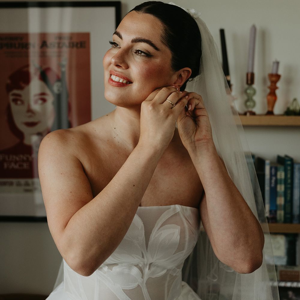 bride-putting-in-earrings