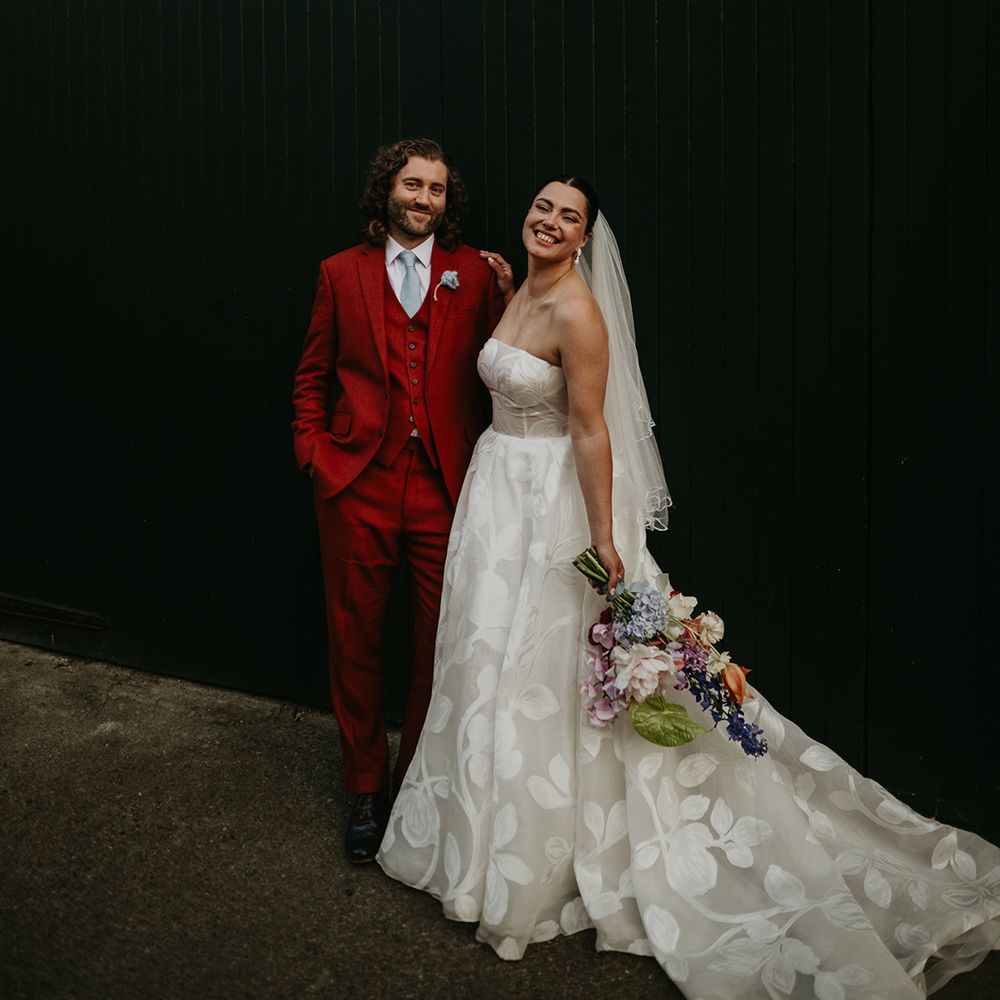 floral-strapless-wedding-dress-with-red-wedding-suit-at-south-london-wedding