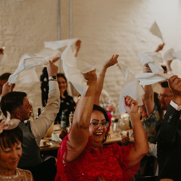 napkin-waving-at-wedding-breakfast-entrance