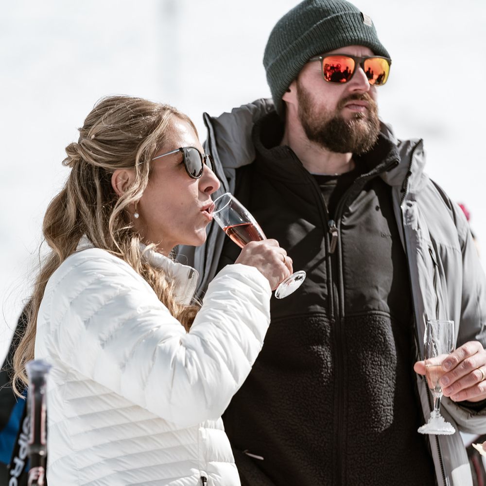 bride-and-groom-at-ski-wedding-drinking-champagne