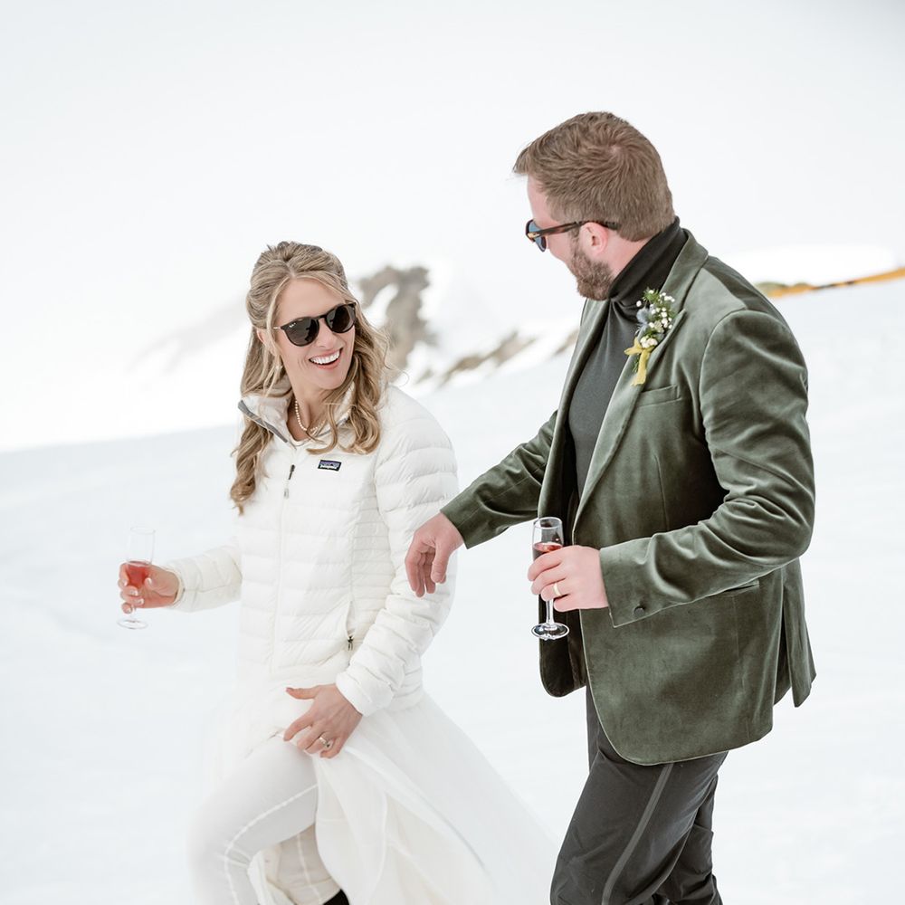 groom-in-green-velvet-suit-jacket-and-bride-in-ski-outfit