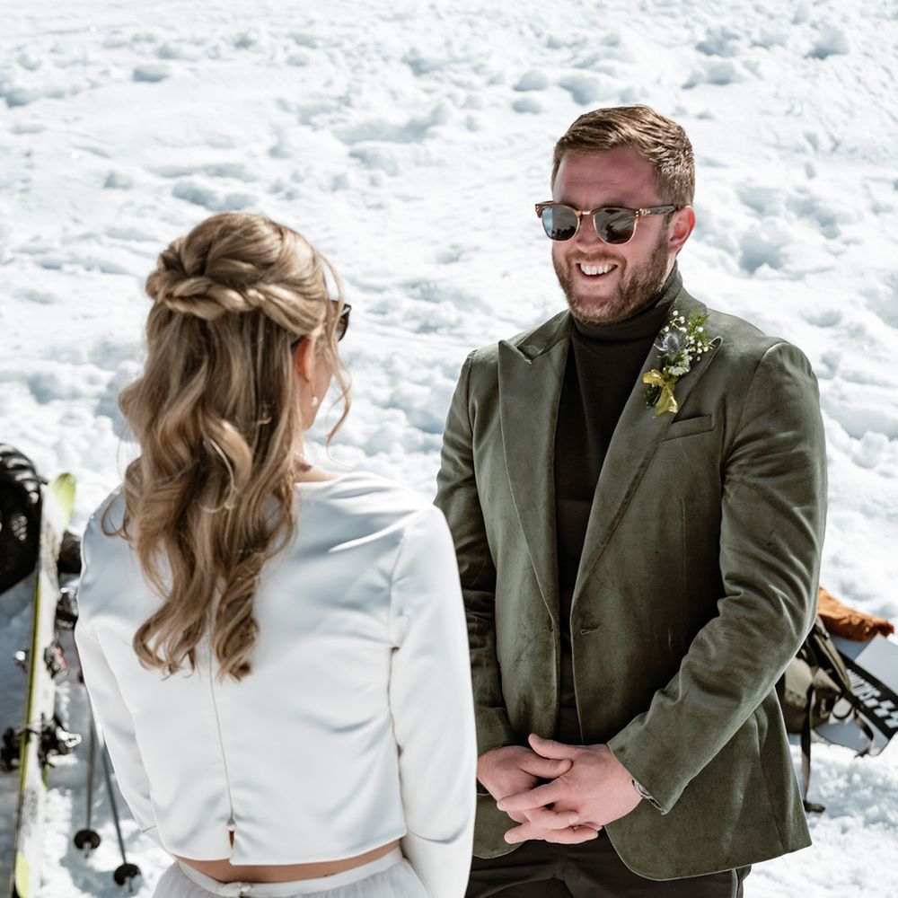 groom-smiles-in-green-velvet-tuxedo-at-the-bride