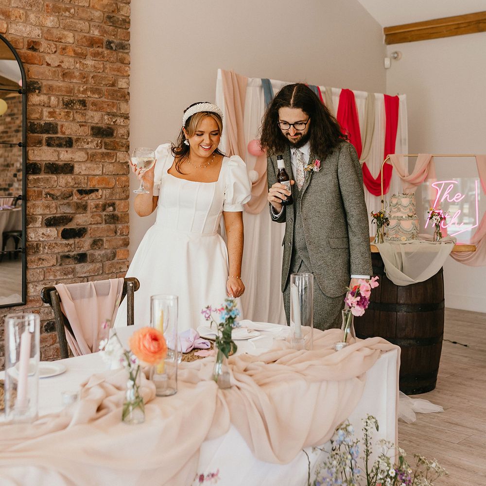 bride-and-groom-see-their-wedding-sweetheart-table
