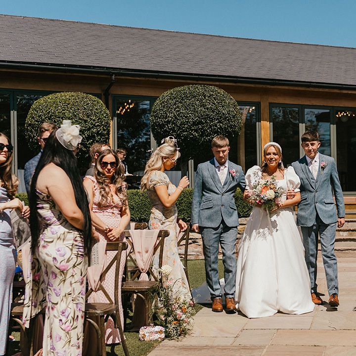 bride-escorted-down-the-aisle