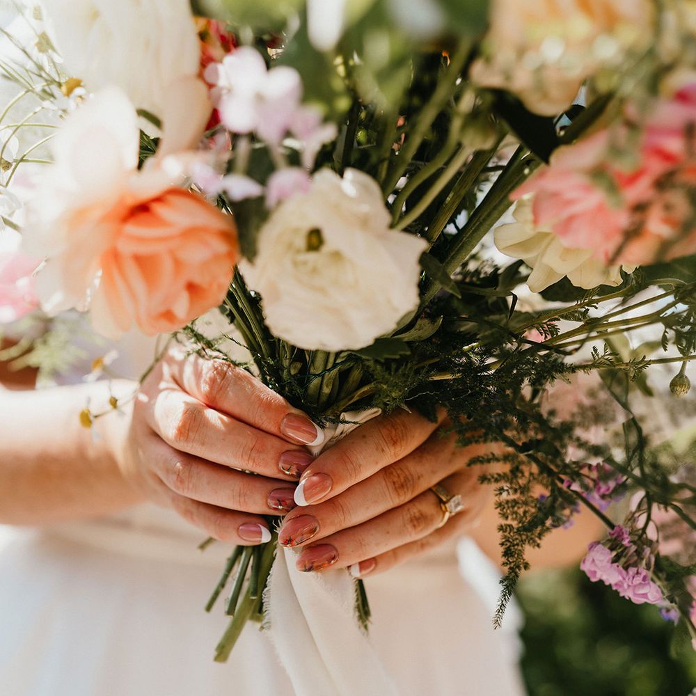 bride-with-floral-nail-art-and-french-tips
