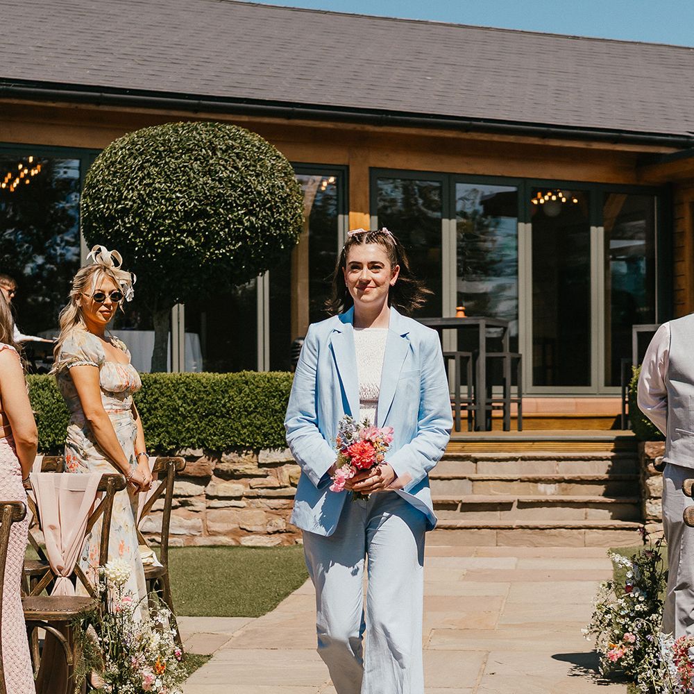 bridesmaid-wearing-light-blue-wedding-suit