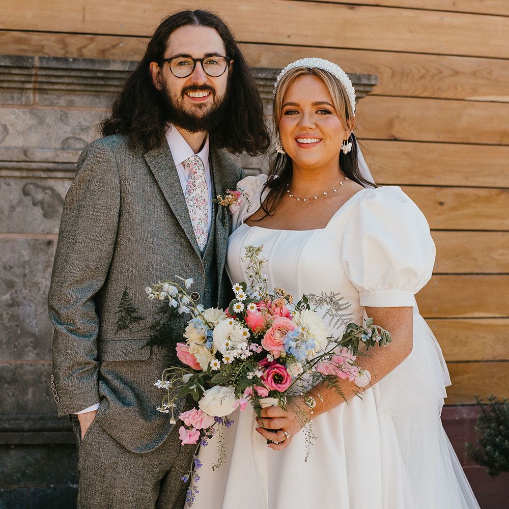 cute-couple-portrait-of-bride-and-groom-smiling-on-wedding-day