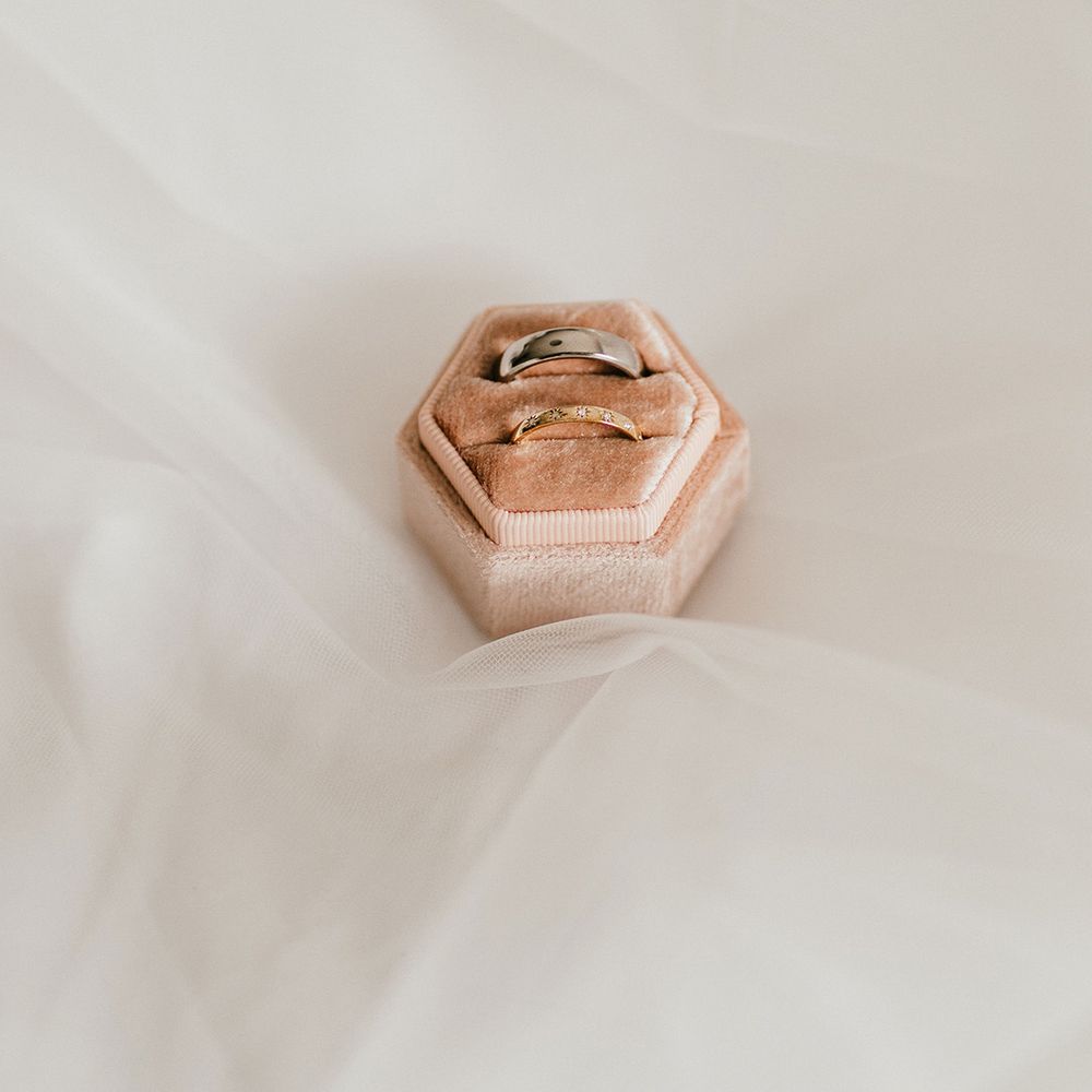 his-and-hers-wedding-bands-in-pink-velvet-ring-box