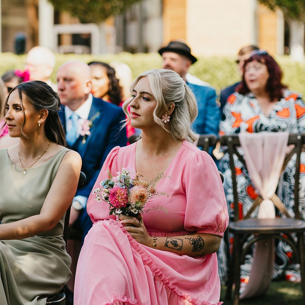 wedding-guest-in-pink-short-sleeve-dress