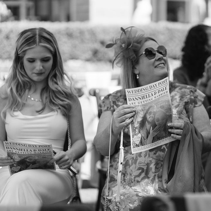 wedding-guests-with-personalised-newspaper