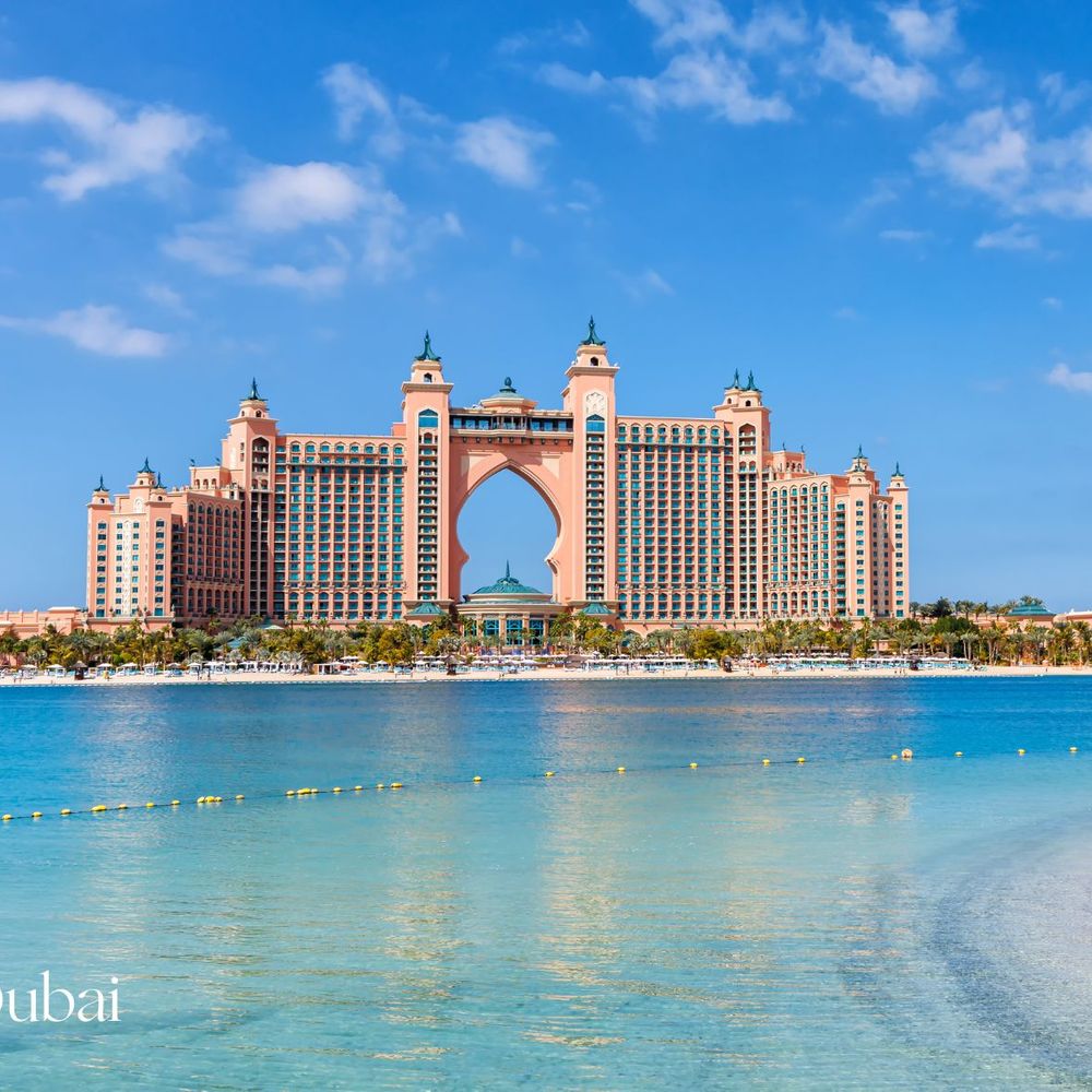 Dubai arched pink hotel building with sea view