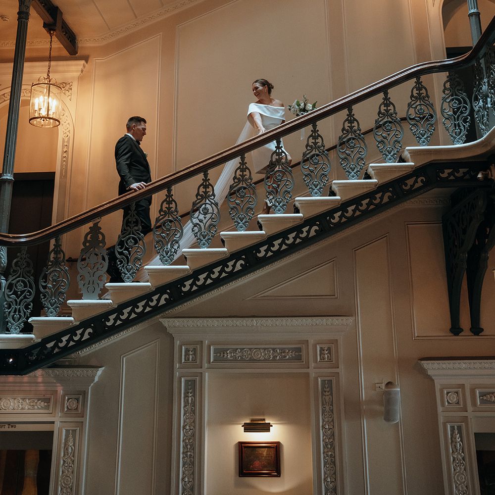 bride-and-groom-walking-on-staircase