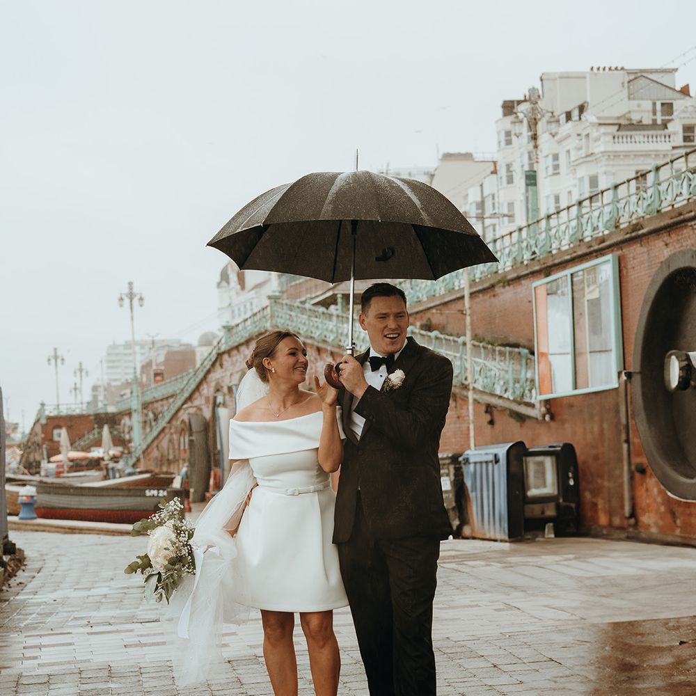 brighton-wedding-with-bride-and-groom-under-umbrella