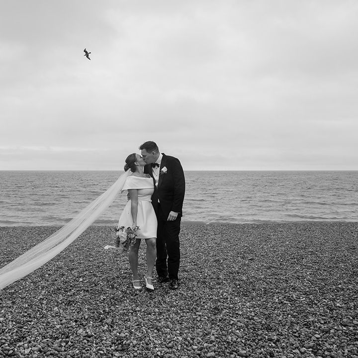 couple-on-pebble-brighton-beach-for-couple-portraits