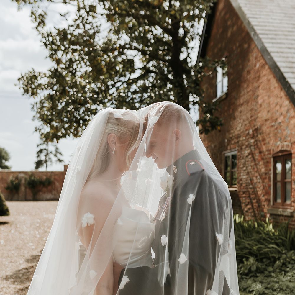 3d-flower-veil-as-couple-embrace-beneath-the-veil