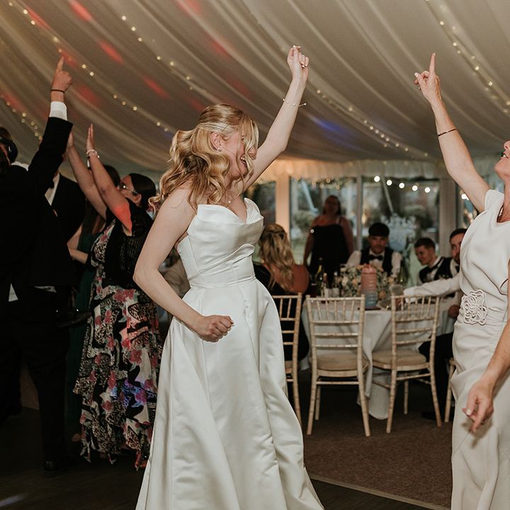 bride-and-mother-of-the-bride-dance-together-at-wedding-reception