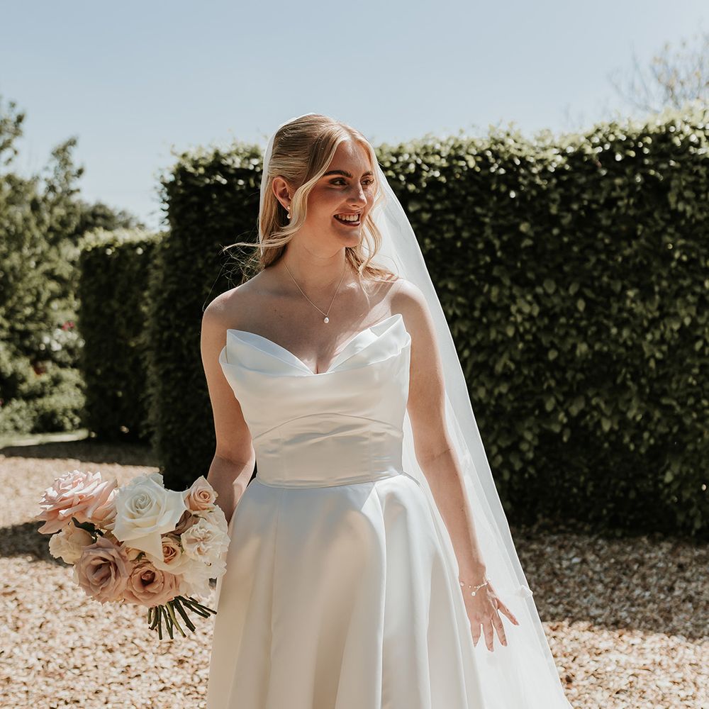 bride-smiling-in-strapless-wedding-dress