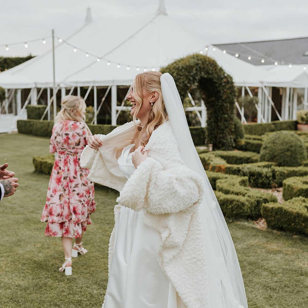 bride-wearing-white-coat-jacket
