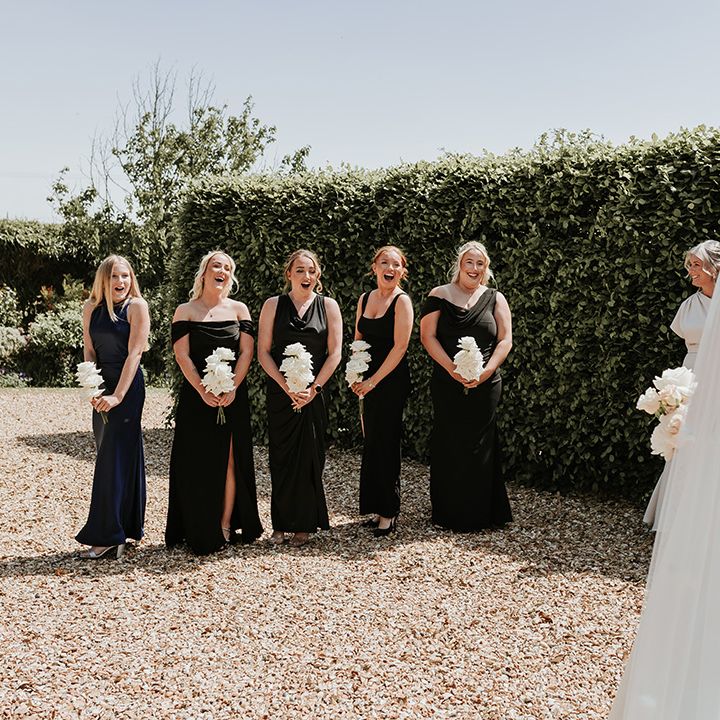 bridesmaids-first-look-at-bride-in-black-dresses